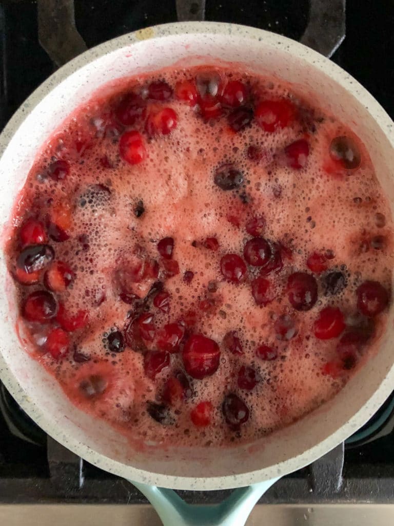 Cranberries simmering in liquid