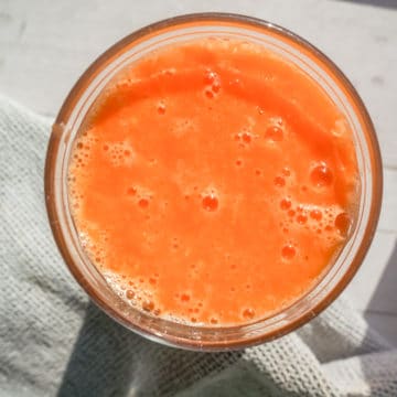 Overhead shot of a Vibrant Orange Colored Smoothie