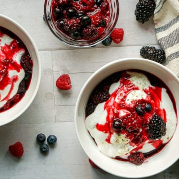 yogurt bowls with berries and berry sauce