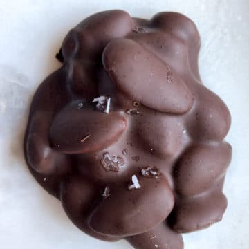DARK CHOCOLATE NUT CLUSTER WITH ESPRESSO ON A WHITE BACKGROUND