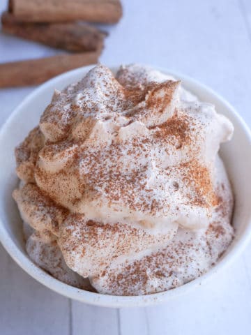 Bowl of creamy homemade cinnamon whipped cream