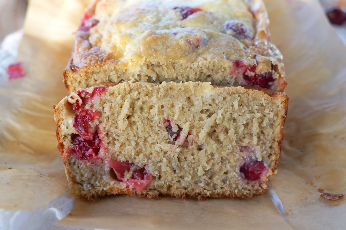 Cranberry cream cheese bread showing a slice of yummy holiday bread.