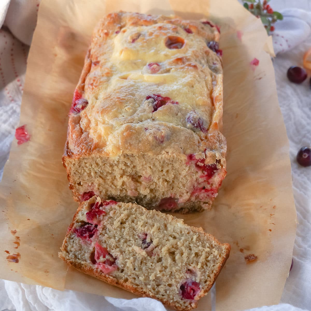 Cranberry cream cheese bread showing a slice of yummy holiday bread.