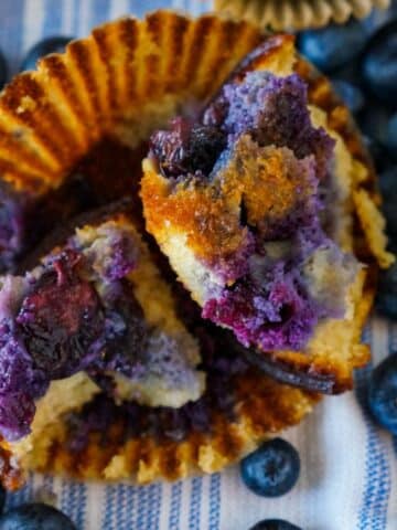 Blueberry Banana Muffin Gluten Free cut in half to show juicy blueberries.