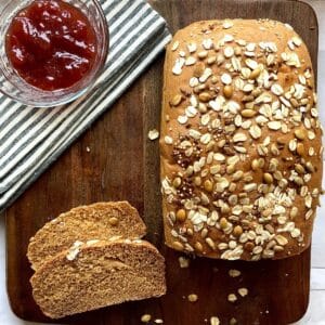 Freshly baked homemade stone ground whole wheat bread on a cutting board