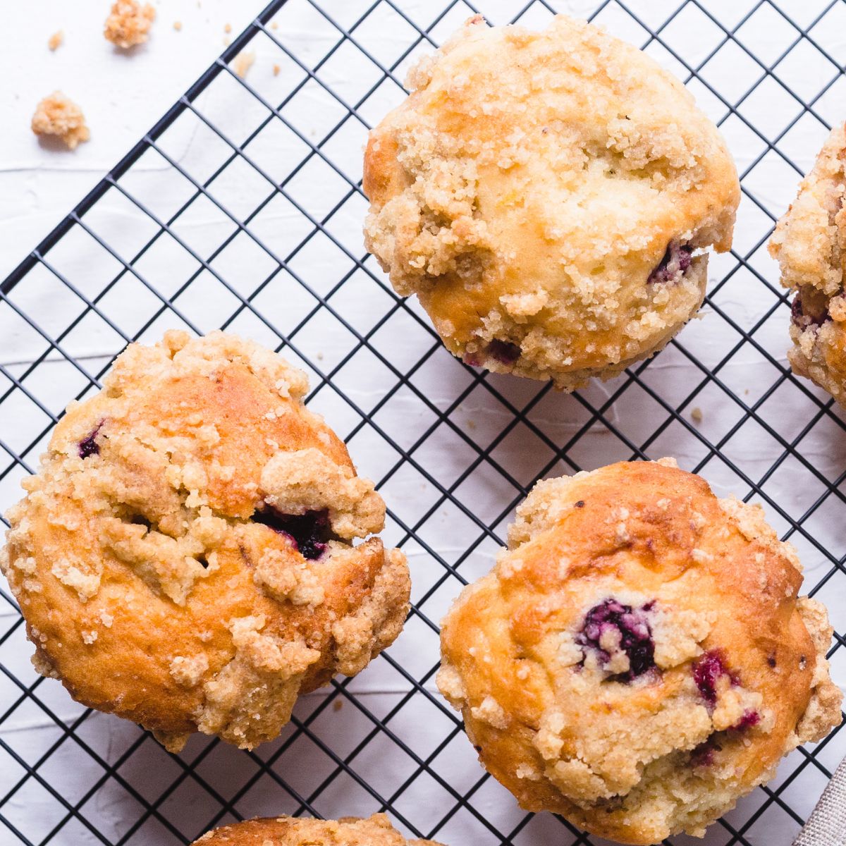 Banana Blackberry Oatmeal Muffins on a Cooling rack after baking.